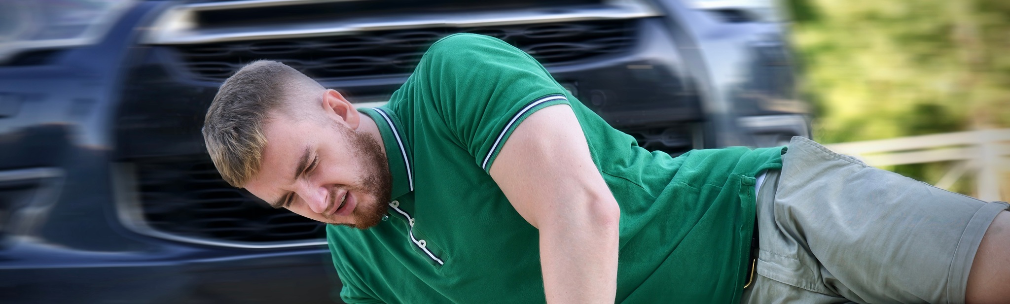 Young Downed Man At Accident Scene, Crash On The Road On Crosswalk. Pedestrian Guy Hit By Careless Driver In A Car On The Road While Crossing Highway, Person Is Lying On Asphalt. Dangerous Situation