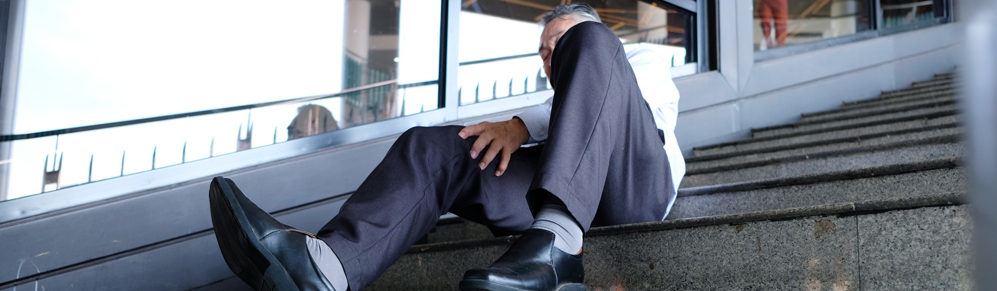 A Man Falls Down The Stairs And Is Injured.