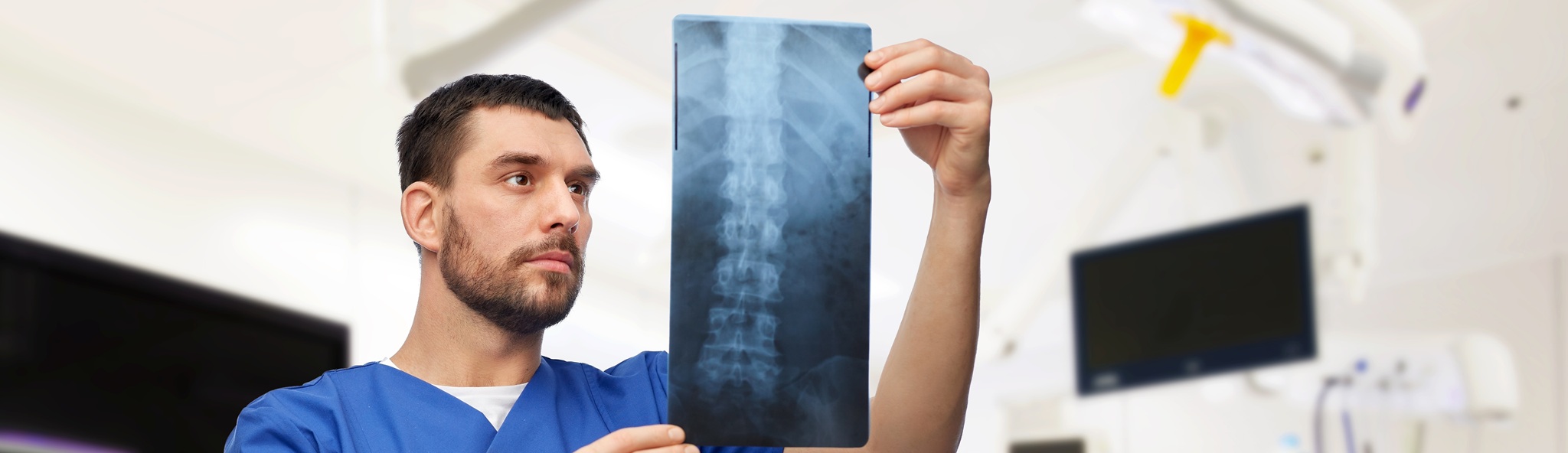 Doctor Or Male Nurse Looking At X Ray Scan