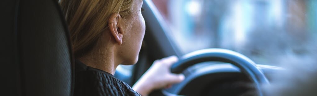 photo of teenage girl driving