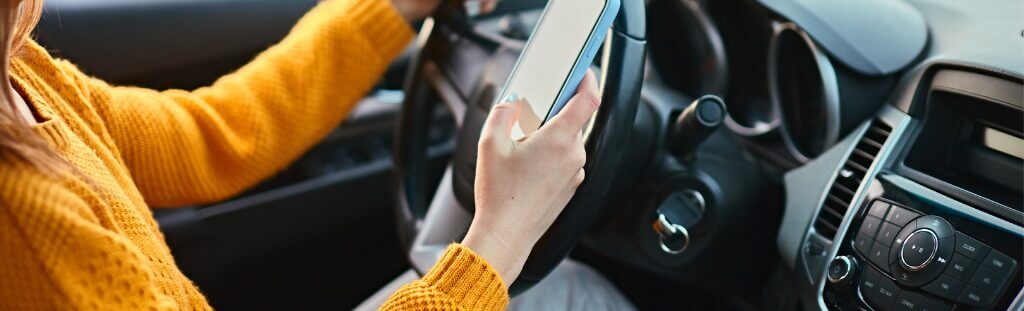 person driving while texting