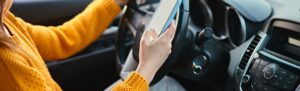 person driving while texting