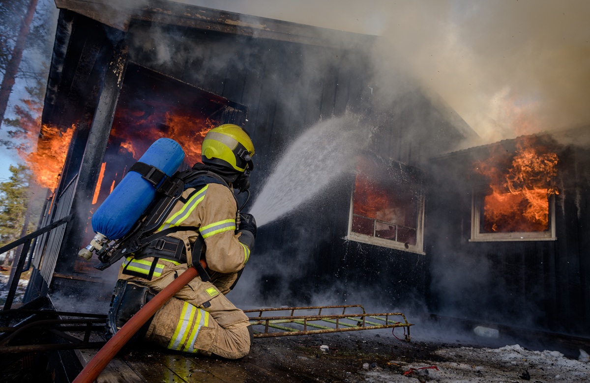 Firefighters Trying To Put Out Flames Cabin On Fire