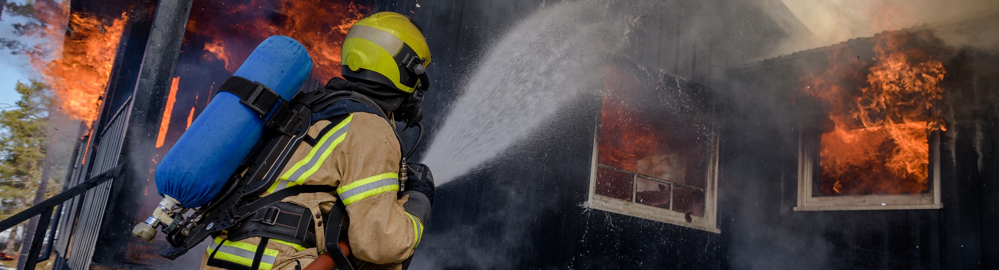 Firefighters Trying To Put Out Flames Cabin On Fire