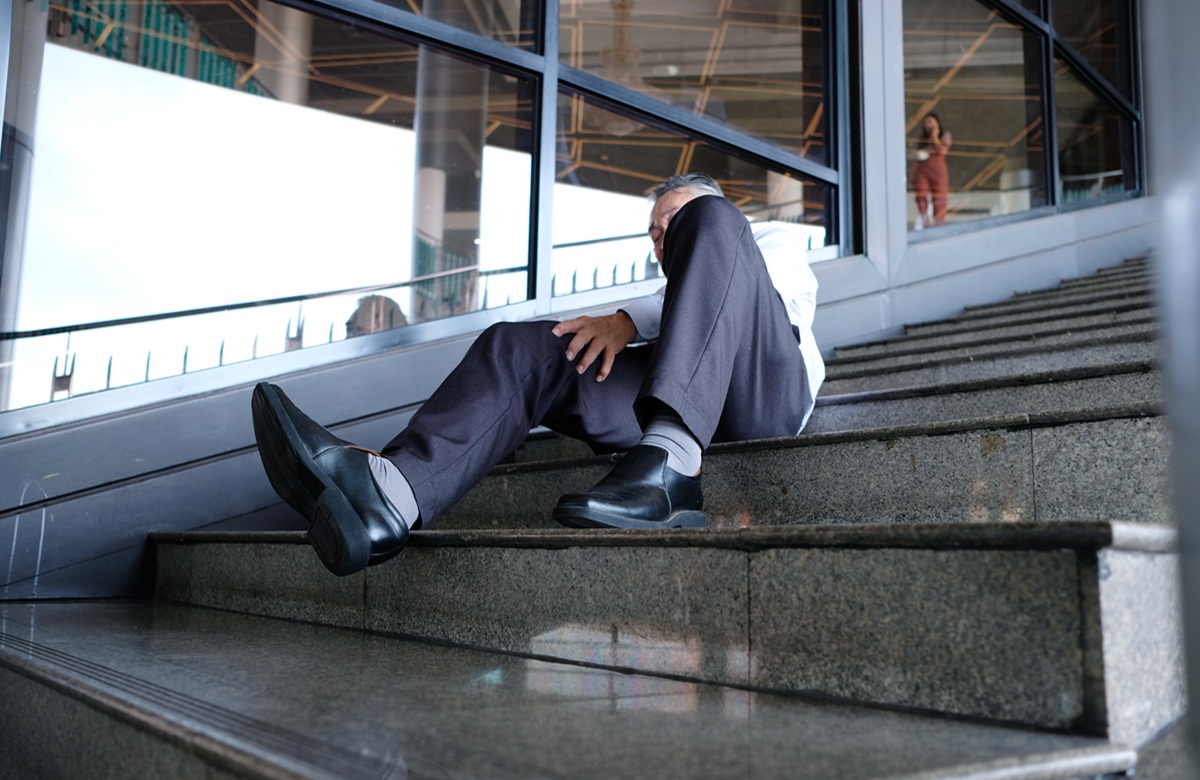 A Man Falls Down The Stairs And Is Injured.