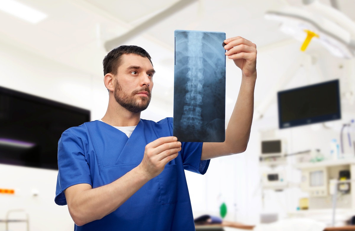 Doctor Or Male Nurse Looking At X Ray Scan