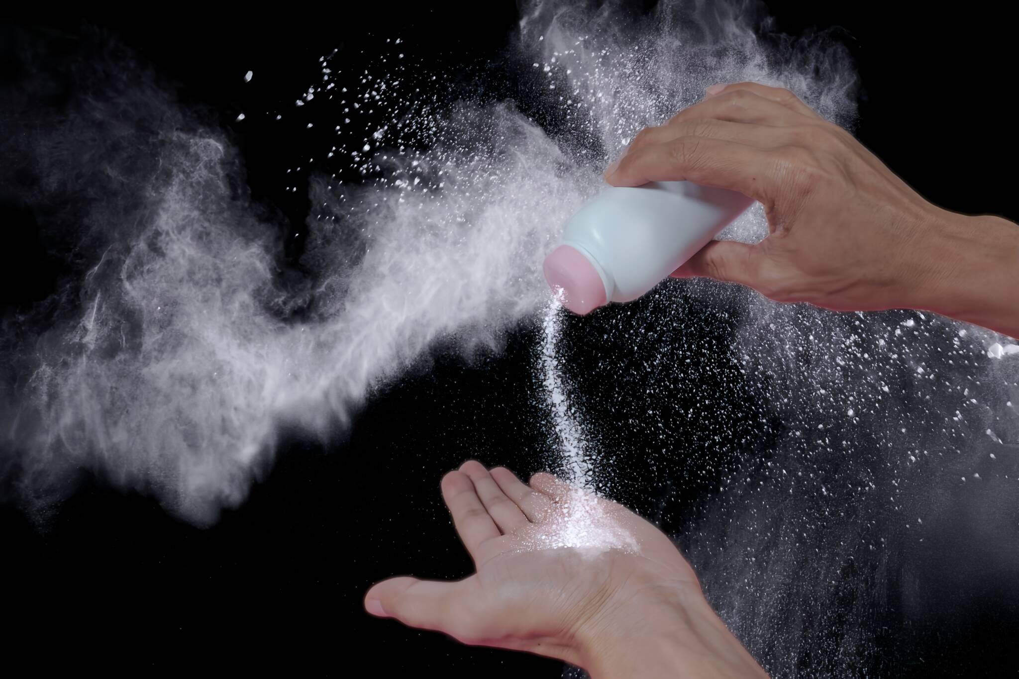 Hand,holding,a,powder,bottle,and,pouring,it.,put,graphics